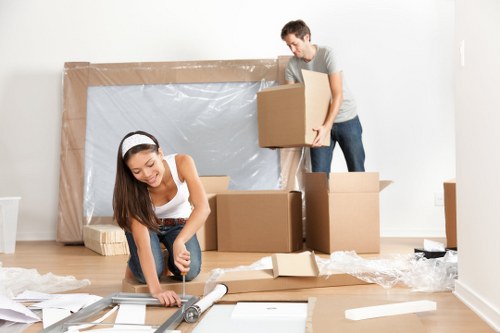 Removal team planning a move in Kentish Town with packed boxes