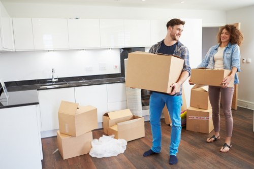 Packed student boxes and furniture ready for local moving transport