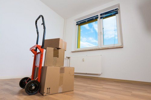 Professional movers transporting household items in Kentish Town