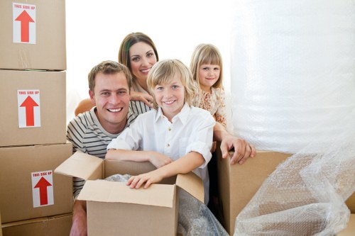 Moving furniture through a Kentish Town property with stairs and tight access